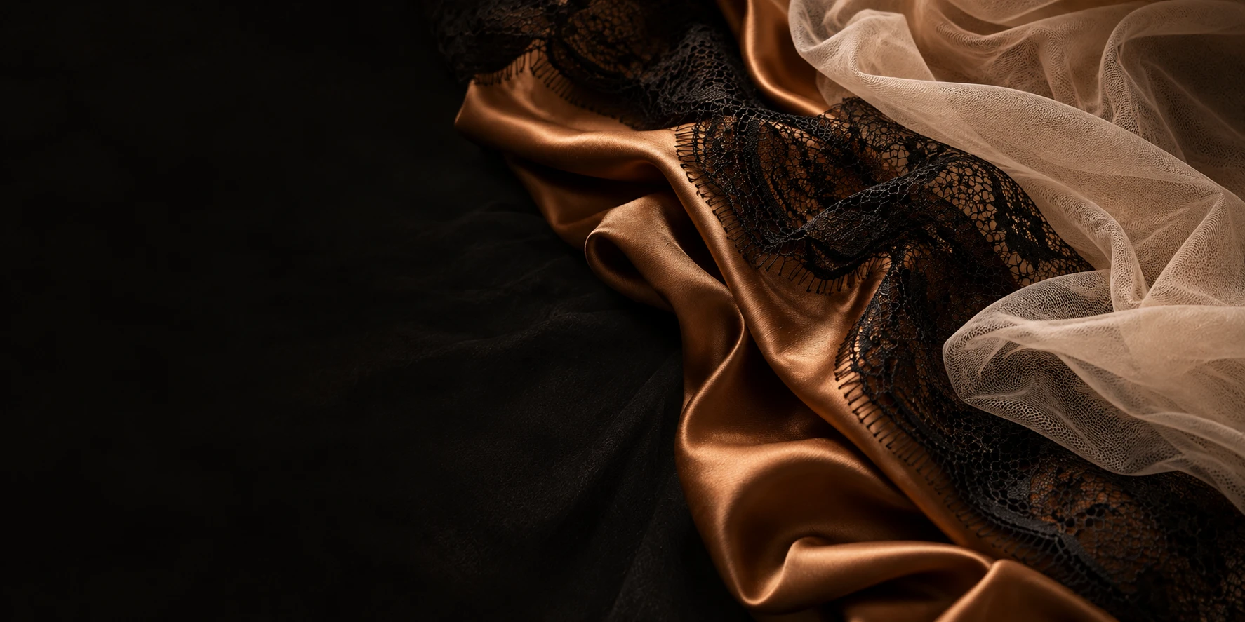 Draped silk and lace in low warm light